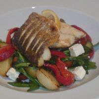 Fillet of Sea Bass with Roasted Red Peppers, Feta, New Potato and Rocket Salad