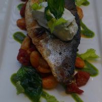 Sea Bass fillet with chorizo, butter bean Cassoulet and salsa Verde